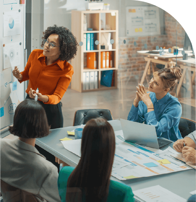 The team discusses business strategy in a meeting room