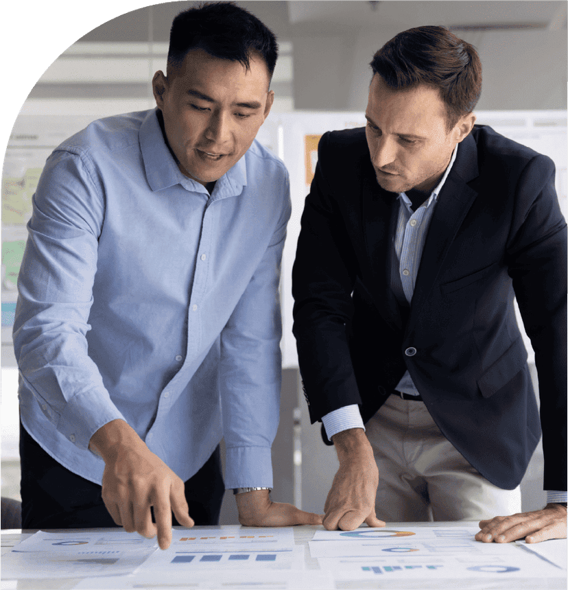 Business professionals reviewing charts and reports during a workforce planning discussion